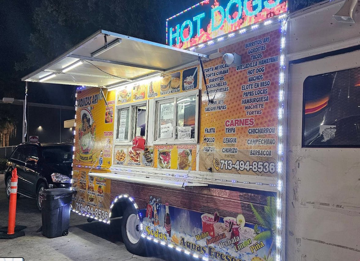 Taquizas Ari food truck serving at night at Truck Stop 77077