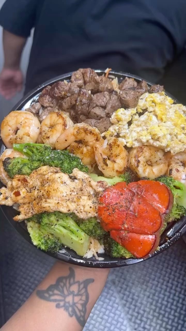A Hood Hibachi platter with lobster tail, steak, shrimp, fried rice and broccoli