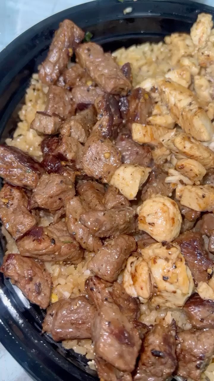 Seared steak and shrimp over fried rice
