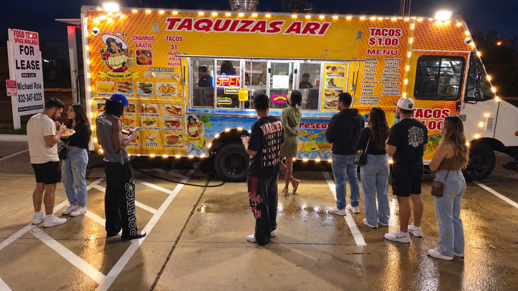 Customers lined up at the Taquizas Ari food truck at night